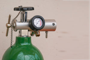 Personal oxygen tank with a regulator on it